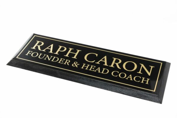 Black and gold nameplate